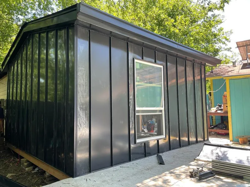 Black standing seam metal wall panels for Roof Inspection in Waxahachie