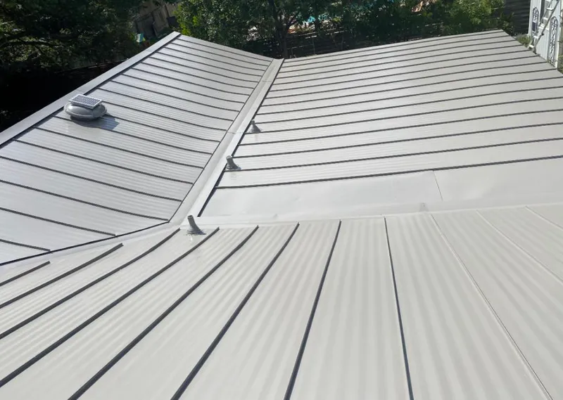 Solar attic fan installed on a metal roof for Roof Ventilation in Waxahachie